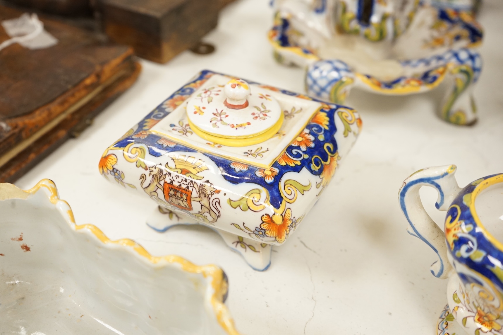 A collection of early 20th century French faience pieces, tallest 37cm